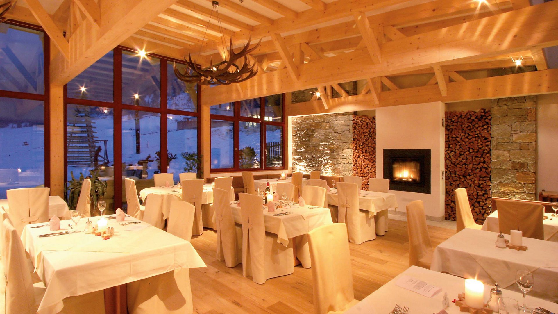 Elegant and inviting restaurant at Hotel Bella Vista, with stylish decor and a cozy atmosphere, perfect for culinary delights amidst the stunning South Tyrolean mountain landscape.